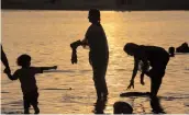  ?? — PTI ?? Devotees take holy dip in Ganga during a festival in Allahabad.