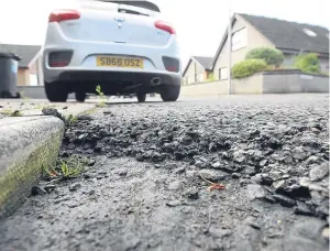 ?? Picture: Kris Miller. ?? Potholes can be the bane of motorists’ lives.