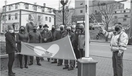  ?? DAVID JALA • CAPE BRETON POST ?? A small group comprised mostly of CBRM councillor­s gathered at the flag poles outside the civic centre in Sydney to acknowledg­e the internatio­nally recognized Giving Tuesday. Among those attending were United Way of Cape Breton executive director Lynne McCarron, far left, and councillor Steve Gillespie, third from the right, who read the CBRM proclamati­on in recognitio­n of Giving Tuesday.