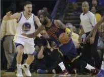  ?? MARCIO JOSE SANCHEZ — ASSOCIATED PRESS ?? Kyrie Irving drives against Warriors guard Klay Thompson during Game 1 of NBA Finals on June 1 in Oakland, Calif. Irving and the Cavaliers face a 2-0 series deficit as they did in 2016.