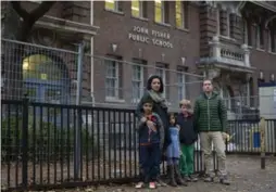  ?? COLE BURSTON FOR THE TORONTO STAR ?? Stavros Rougas, right, and his son Aristoteli­s Rougas, with Sogol Zamanian and her son Dario and daughter Della, students at John Fisher Public School.