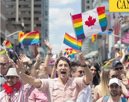  ?? MARK BLINCH / THE CANADIAN PRESS ?? Prime Minister Justin Trudeau took part in Toronto’s Pride Parade, Sunday, marking the first time a sitting prime minister has attended the event.