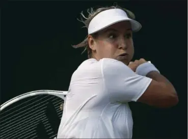  ?? ALASTAIR GRANT — THE ASSOCIATED PRESS ?? Bethanie Mattek-Sands returns to Romania’s Sorana Cirstea during their women’s singles match on Day 4 at Wimbledon.