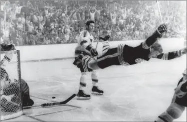  ?? RAY LUSSIER — THE BOSTON HERALD VIA AP ?? Bobby Orr goes celebrates after scoring a goal against the St. Louis Blues that won the Stanley Cup for the Bruins in 1970 in Boston.