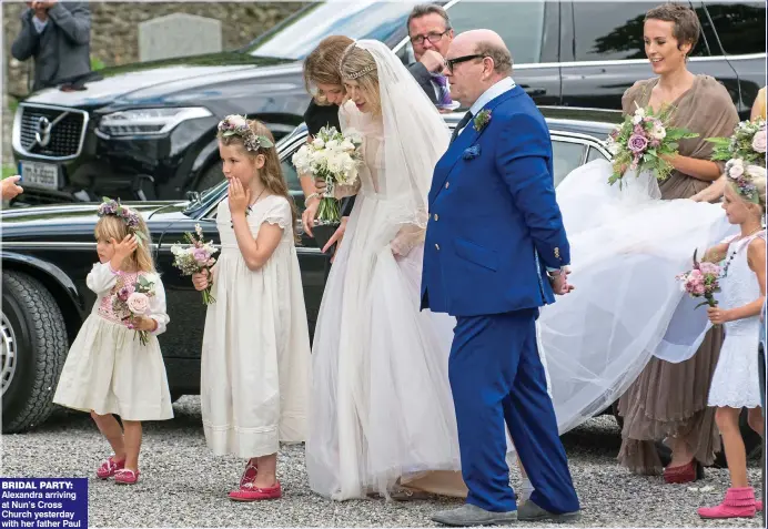  ??  ?? BRIDAL PARTY: Alexandra arriving at Nun’s Cross Church yesterday with her father Paul