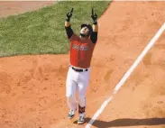  ?? Winslow Townson / Associated Press ?? Boston’s Michael Chavis points skyward after hitting a fifth-inning homer against Houston.