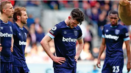  ?? REX ?? Tough to take: a dejected Declan Rice looks to the floor as West Ham near defeat