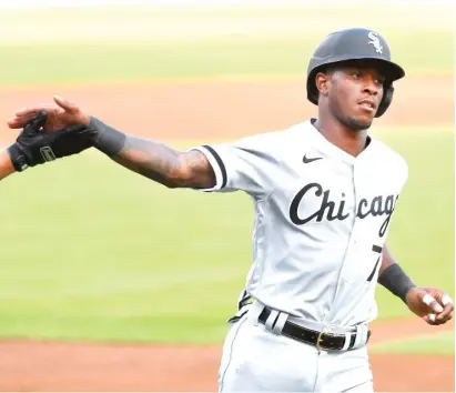  ?? PAUL SANCYA/AP ?? The Sox’ Tim Anderson scored two runs Tuesday against the Tigers in his return from a strained groin.