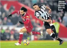  ??  ?? Jamaal Lascelles clashes with Mo Salah