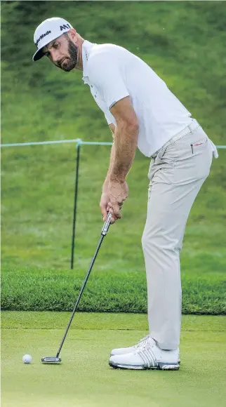  ?? PHOTOS: DAVID COOPER/THE CANADIAN PRESS ?? Dustin Johnson, seen lining up a putt on the sixth green during the RBC Canadian Open pro-am in Oakville, Ont., on Wednesday, says he’s “played well” at Glen Abbey recently.