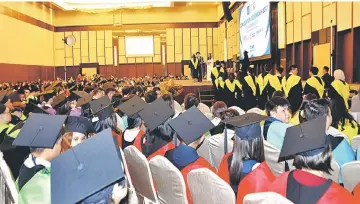  ??  ?? Graduates wait their turn to receive their scroll at SEGi College Sarawak’s Convocatio­n 2017 ceremony.