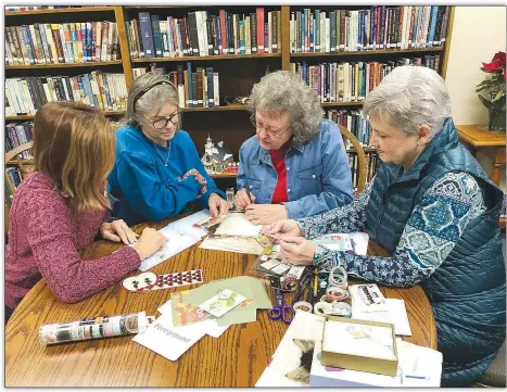  ?? Becca Martin-Brown NWA Democrat-Gazette ?? Deena Guptil (from left), Nancy Brennan, Pat Kirby and Mary Green gather to plan for the next meeting of the Northwest Arkansas Letter Writing Society. Only about a year old, the group meets at the Bella Vista Public Library to share correspond­ence, create mail art and keep alive the personal connection of letters written on paper and mailed.