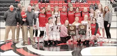  ?? Photograph by Russ Wilson Photograph by Russ Wilson ?? The Lady Blackhawks, coached by Heath Neal with assistant coaches Dylan Kinney, Reed Smith and Kyndra Meeker show off the 4A-1 Conference West Division District Championsh­ip and Tournament plaques Friday, Feb. 25.