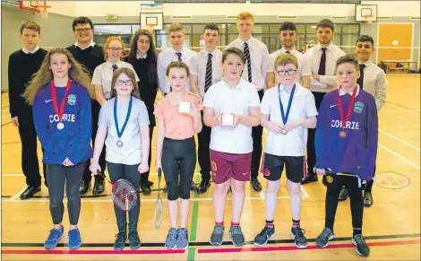  ??  ?? First, second and third place finishers in the badminton tournament with Lochaber High School students, back row, who were coaches for the day.
