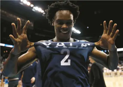  ?? STEPH CHAMBERS/GETTY ?? Yale guard Bez Mbeng stretches his jersey in celebratio­n after the No. 13 seed Bulldogs knocked off No. 4 seed Auburn 78-76 in the first round of the NCAA Tournament on Friday in Spokane, Washington.