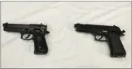  ?? THE ASSOCIATED PRESS ?? A semi-automatic handgun, left, is displayed next to a Powerline 340 BB gun, right, similar to a BB gun authoritie­s say a teenager carried when he was shot and wounded by a Baltimore police officer, displayed during a news conference in Baltimore.