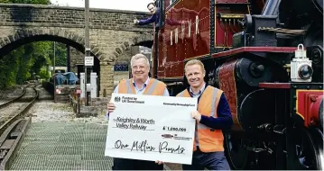  ?? KWVR ?? Pictured standing on bridge 27, which is located at the throat of Haworth yard and locomotive depot, are left to right: Nick Bennett, chairman of the railway’s operating company, and Robbie Moore, MP for Keighley and Ilkley. In the cab of BR ‘2MT’ 2-6-2T No. 41241 is KWVR volunteer Tom Kay giving the news the thumbs-up. LEFT: