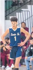  ?? EDDIE MOORE/JOURNAL ?? J.B. White catches his breath during action last December at the Al Armendariz Tournament at Capital High School in Santa Fe. White was shot to death Saturday.