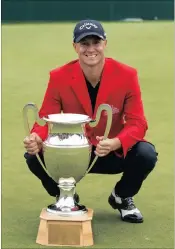  ?? ASSOCIATED PRESS PICTURE: ?? THE WINNER: Alex Noren of Sweden poses with the trophy after the final round of the Omega European Masters golf tournament in Crans-Montana, Switzerlan­d, yesterday. Noren sank a 20-metre birdie putt on the first extra hole to beat Scott Hend of...