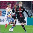  ?? FOTO: IMAGO ?? Julian Brandt (rechts) war gegen Mainz nicht zu stoppen – auch nicht von Leandro Barreiro.