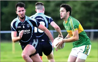  ??  ?? Tourlestra­ne’s Johnny Kelly (right) in action against St John’s Oisin Cox. Photo: Tom Callanan.