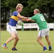  ??  ?? Noel Dempsey of Our Lady’s Island battles with Richard Bent of St Mary’s Rosslare.