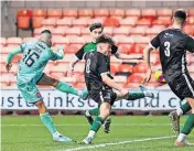  ?? ?? Blow Dundee United’s Aziz Behich open the scoring