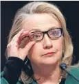  ??  ?? Fine view: Hillary Clinton adjusts her glasses.