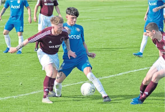  ?? Picture: Chris Ritchie. ?? Action from North End’s (maroon) 3-1 Super League win against Lochee United last week.