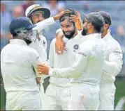  ?? AFP ?? Hanuma Vihari (centre) dismissed Marcus Harris off just his second delivery to give India a much-needed breakthrou­gh.