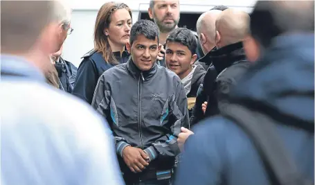  ?? Picture: PA. ?? Two teenaged refugees arrive at Lunar House in Croydon, south London.