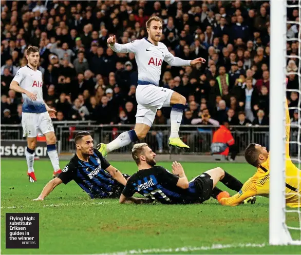  ?? REUTERS ?? Flying high: substitute Eriksen guides in the winner