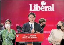  ?? SEAN KILPATRICK THE CANADIAN PRESS FILE PHOTO ?? Liberal Leader Justin Trudeau is joined on stage by wife Sophie Grégoire, left, and children Xavier and Ella-Grace, right, during his victory speech. Heather Scoffield argues a minority can work on issues like child care and housing.