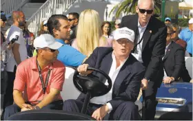  ?? Luis M. Alvarez / Associated Press 2016 ?? Donald Trump drives himself around Trump National Doral Golf Club during the WGCCadilla­c Championsh­ip while campaignin­g for president in March 2016.