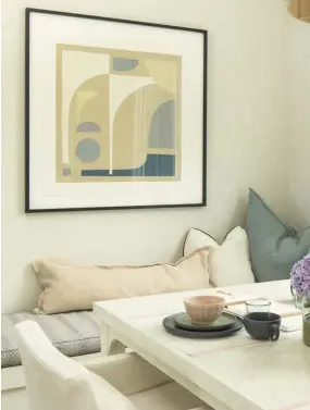  ??  ?? |TOP RIGHT| ART FOR THE MOOD. The black-framed abstract wall art from Minted brings an element of modern elegance and counterbal­ance to the pops of colorful pillows.