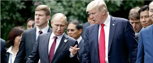  ?? — AP ?? US President Donald Trump with his Russian counterpar­t Vladimir Putin at the APEC summit in Vietnam.