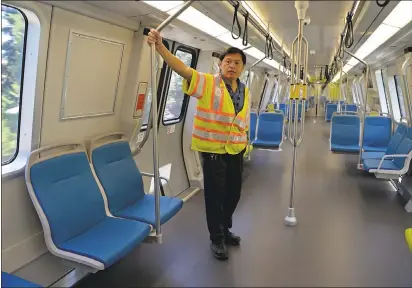  ?? JOSE CARLOS FAJARDO — STAFF ARCHIVES ?? BART engineer Rodney Lim rides in one of BART’s new train cars during a media tour at the South Hayward BART station in Hayward on July 24, 2017. BART is in the process of replacing its 669train cars with 775new ones by the end of 2021.