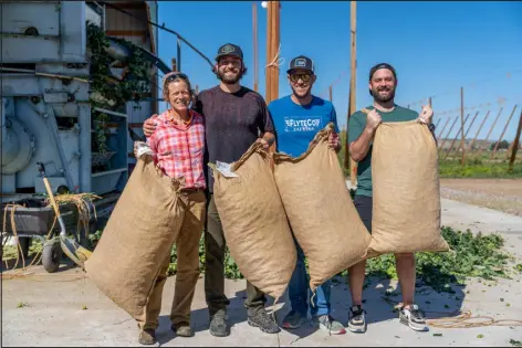  ?? PROVIDED BY FLYTECO BREWING ?? Billy Goat Hop Farm co-owner Audrey Gehlhausen poses with Flyteco Brewing owners Jason Slingsby, Eric Serani and Morgan O’sullivan during a special day trip to the Western Slope in 2022. The brewery’s owners picked up fresh hops for use in a seasonal West Coast IPA.