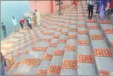  ??  ?? Preparatio­ns on for attempt to set a world record on Chhoti Diwali by lighting 171,000 earthen oil lamps in Ayodhya on Tuesday.