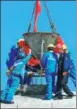  ?? CHEN JUNFENG / XINHUA ?? Workers pour cement to seal the roof of a building in the China-Belarus Industrial Park in June.