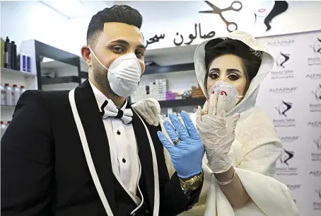  ?? AFP ?? Palestinia­n groom Ammar and bride Baraa show off their rings ahead of their wedding ceremony in a West Bank village near Hebron on Saturday.