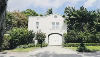  ?? THE ASSOCIATED PRESS ?? The gatehouse entrance of the waterfront mansion once owned by gangster Al Capone in Miami Beach, Florida. The nine-bedroom house that Capone owned for nearly two decades, and died in, is about to be demolished by the new owners, who bought it for $10.75 million US this summer.