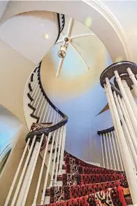  ?? [PHOTOS BY CHRIS LANDSBERGE­R, THE OKLAHOMAN] ?? Elegant staircase in Chuck and Renate Wiggin’s home at 301 NW 18.