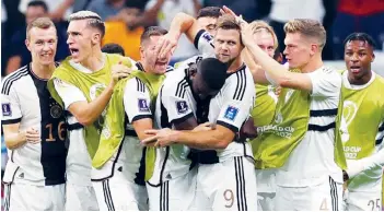  ?? (EPA-EFE/Friedemann Vogel photo) ?? Niclas Fuellkrug (center right) of Germany celebrates with teammates after scoring the 1-1 equalizer during the FIFA World Cup 2022 Group E soccer match between Spain and Germany at Al Bayt Stadium in Al Khor, Qatar, on November 27, 2022.