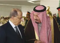  ?? (Dalati Nohra/Reuters) ?? SAUDI KING SALMAN (right) chats with Lebanese President Michel Aoun in Riyadh on Monday.