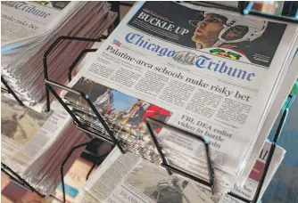  ?? KIICHIRO SATO/AP FILE ?? Chicago Tribune parent company Tronc Inc. is renaming itself Tribune Publishing Co.