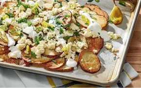  ?? WASHINGTON POST ?? These Greek-ish potato nachos have spuds standing in for the more traditiona­l nachos.