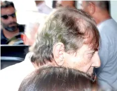  ??  ?? Brazilian spiritual healer Joao Teixeira de Faria, known as ‘John of God’, arrives at a the police station a day after being officially ruled a fugitive, in Goiania, Brazil. — Reuters photo