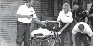  ?? Arkansas Democrat-Gazette file photo ?? Emergency medical workers with an empty stretcher leave Kimpel Hall on the campus of the University of Arkansas, Fayettevil­le after a shooting in 2000.