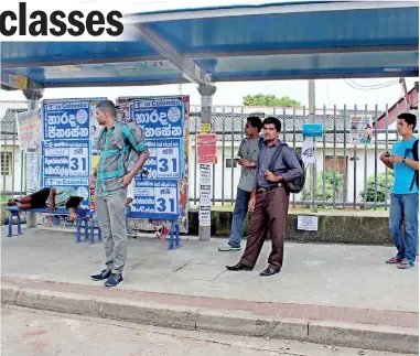  ??  ?? Beggars, commuters and ugly tuition adds... Not a very nice advertisem­ent for the Moratuwa town